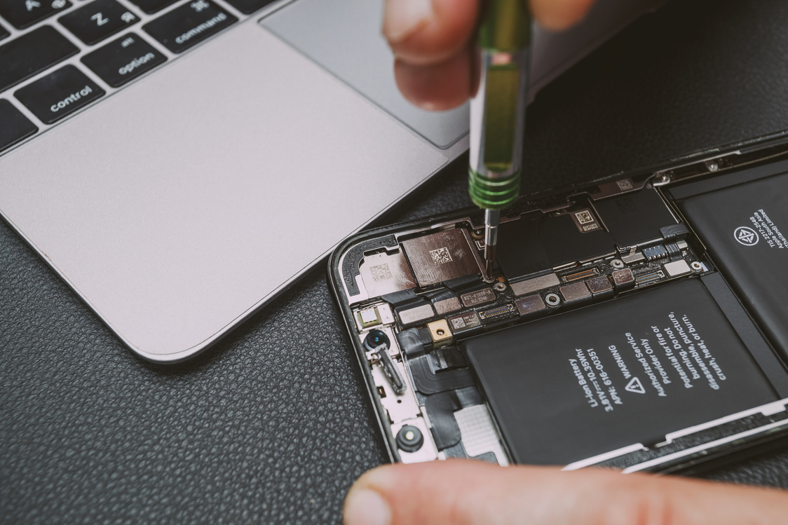 Technician Repairing Smartphone